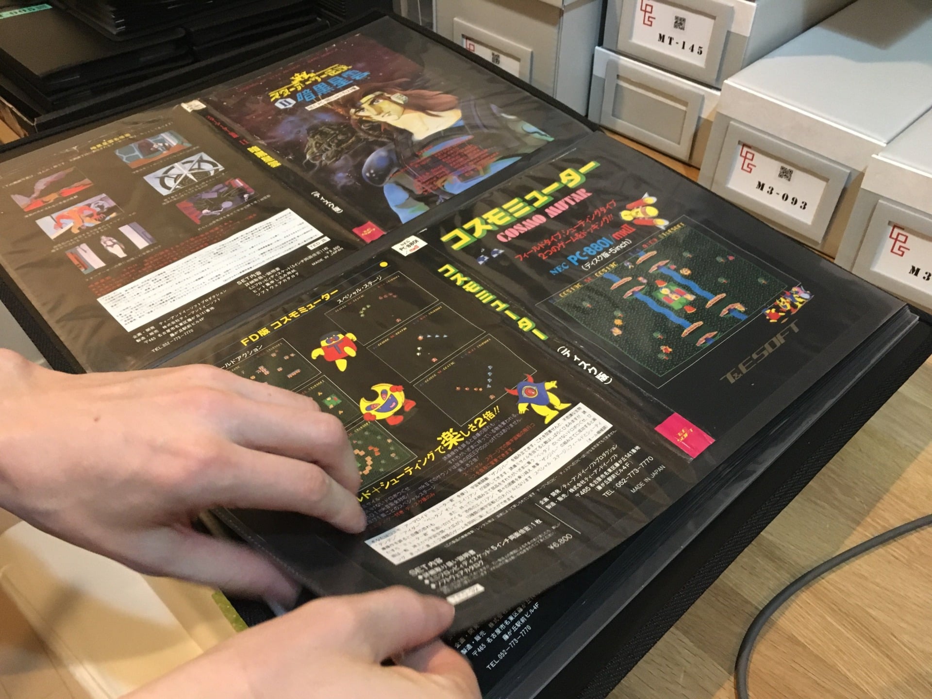 Game slipcovers are stored in artwork portfolios.