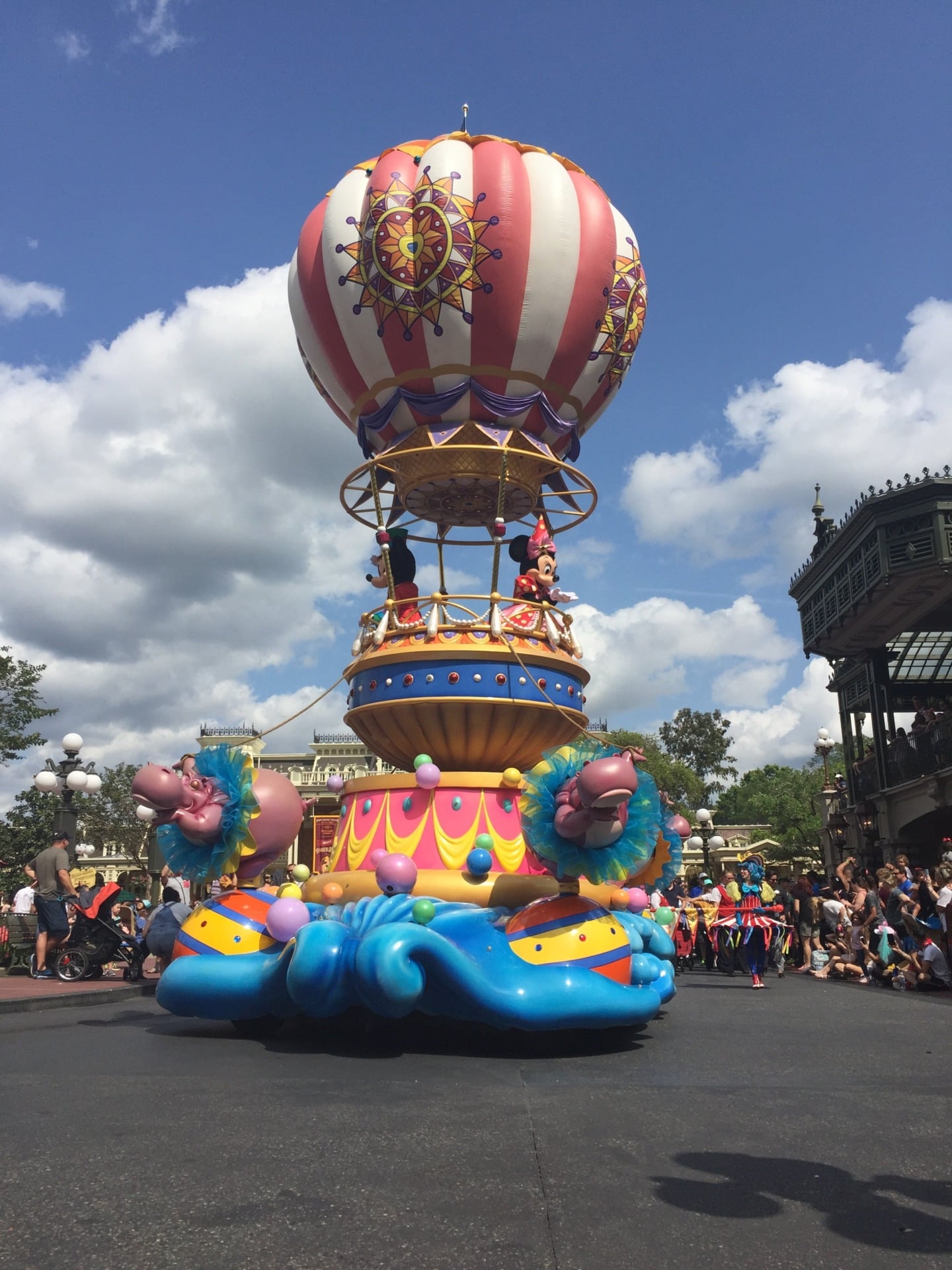 Mickey Mouse and Minnie Mouse on their parade float at the Magic Kingdom.