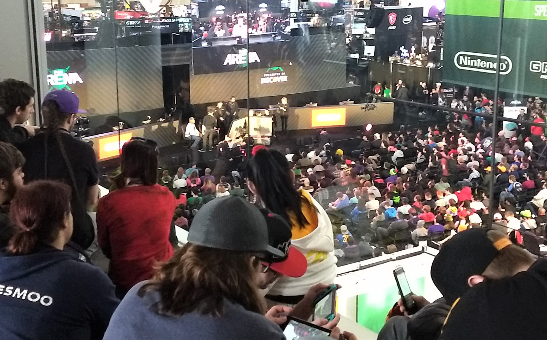 Fans and PAX East attendees watching the tournament from the skybridge. 
