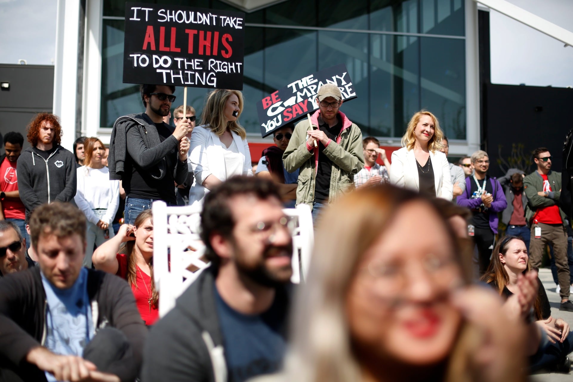 Los Angeles-based Riot Games employees listen to a speaker during the walkout at on May 6, 2019.