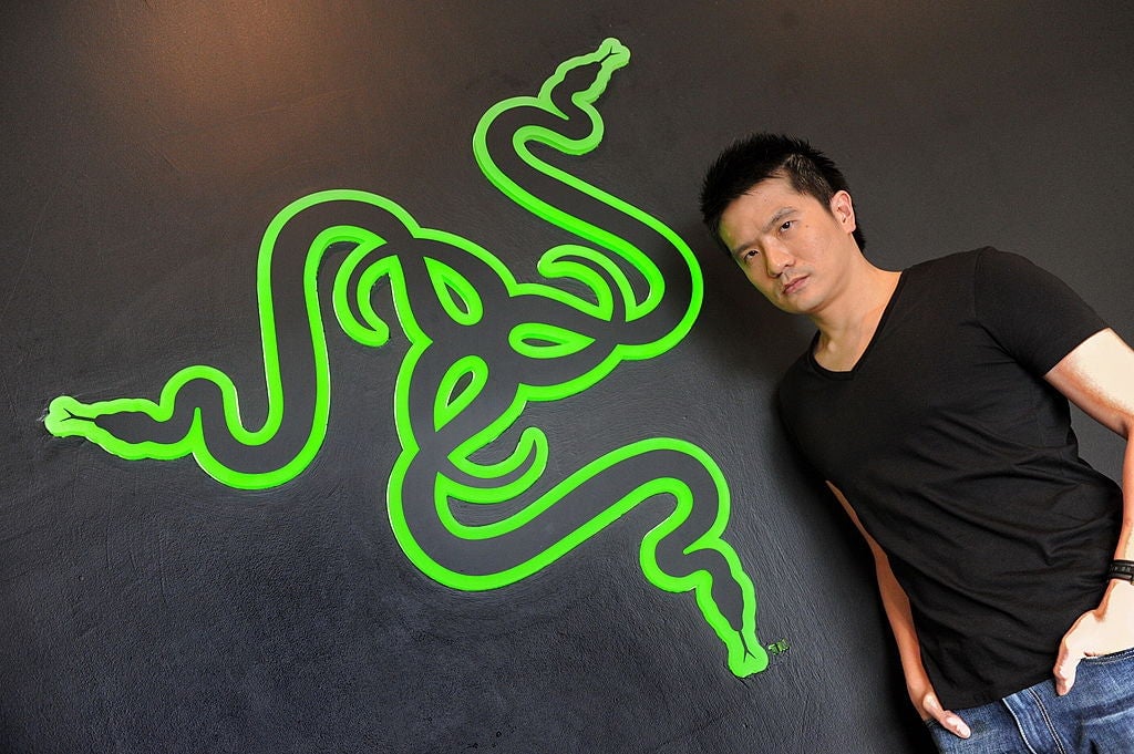 Min-Liang Tan posing in front of the Razer logo in 2011.