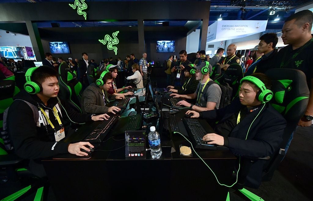 Consumer Electronic Show (CES) attendees gaming with Razer hardware in 2017.