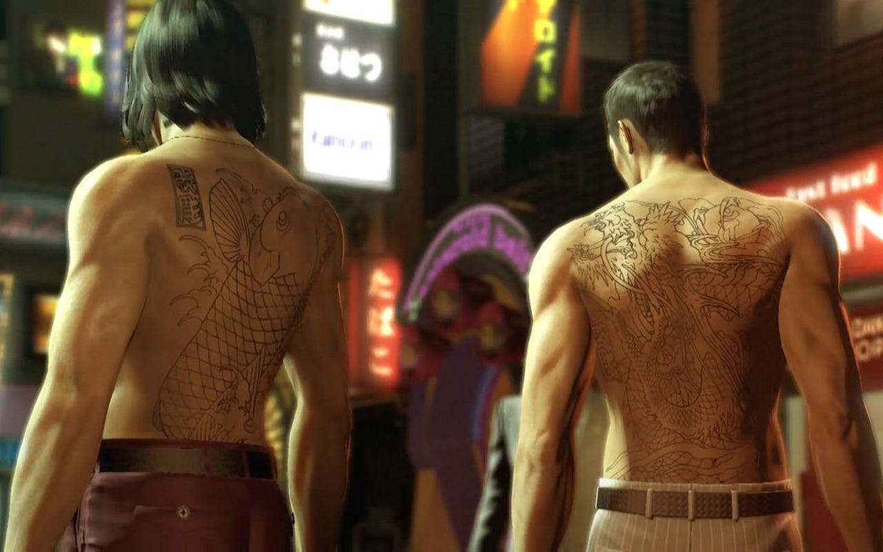 In the upper right of Dojima’s koi fish tattoo, there is a tattooer’s seal for the artist to sign the work. Color is typically inked last once the piece is completed. 