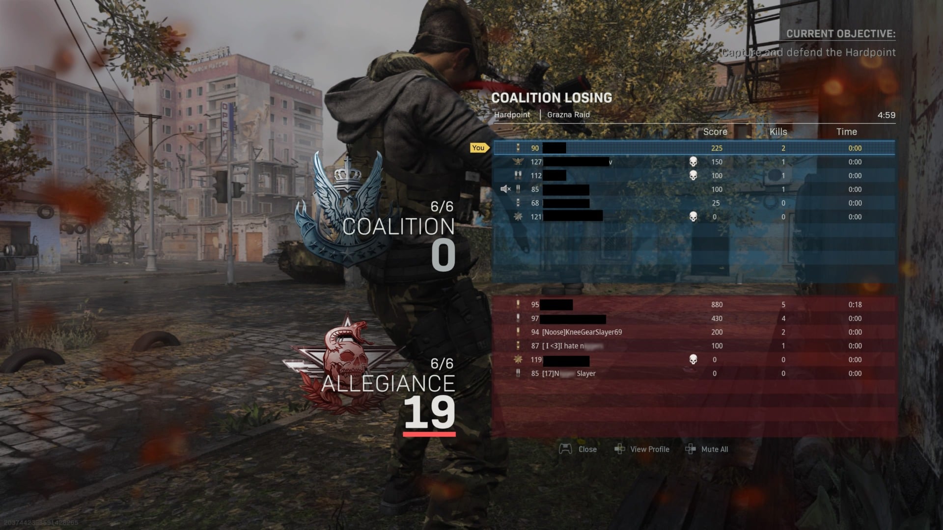 A screenshot of a Call of Duty match showing players with racial slurs in their display names. (Names without slurs have been redacted for the players’ privacy.)