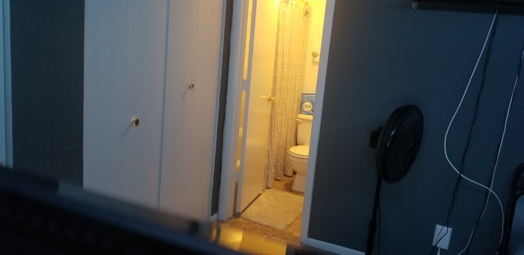 View of my toilet from behind my TV. (I didnāt have pants on.)