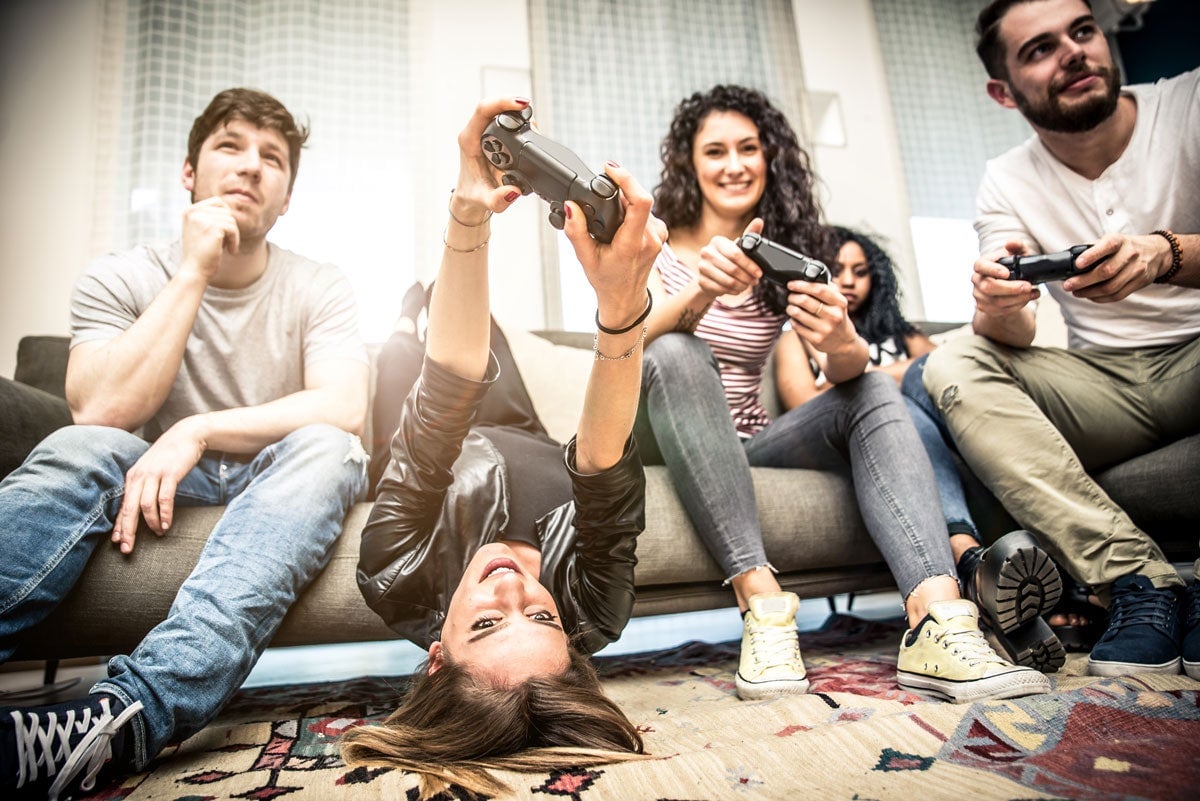 Everybody should play games, even people pretending to play for stock photos.