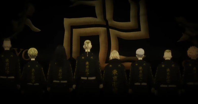 Members of the Tokyo Manji Gang stand in front of a giant manji symbol. 