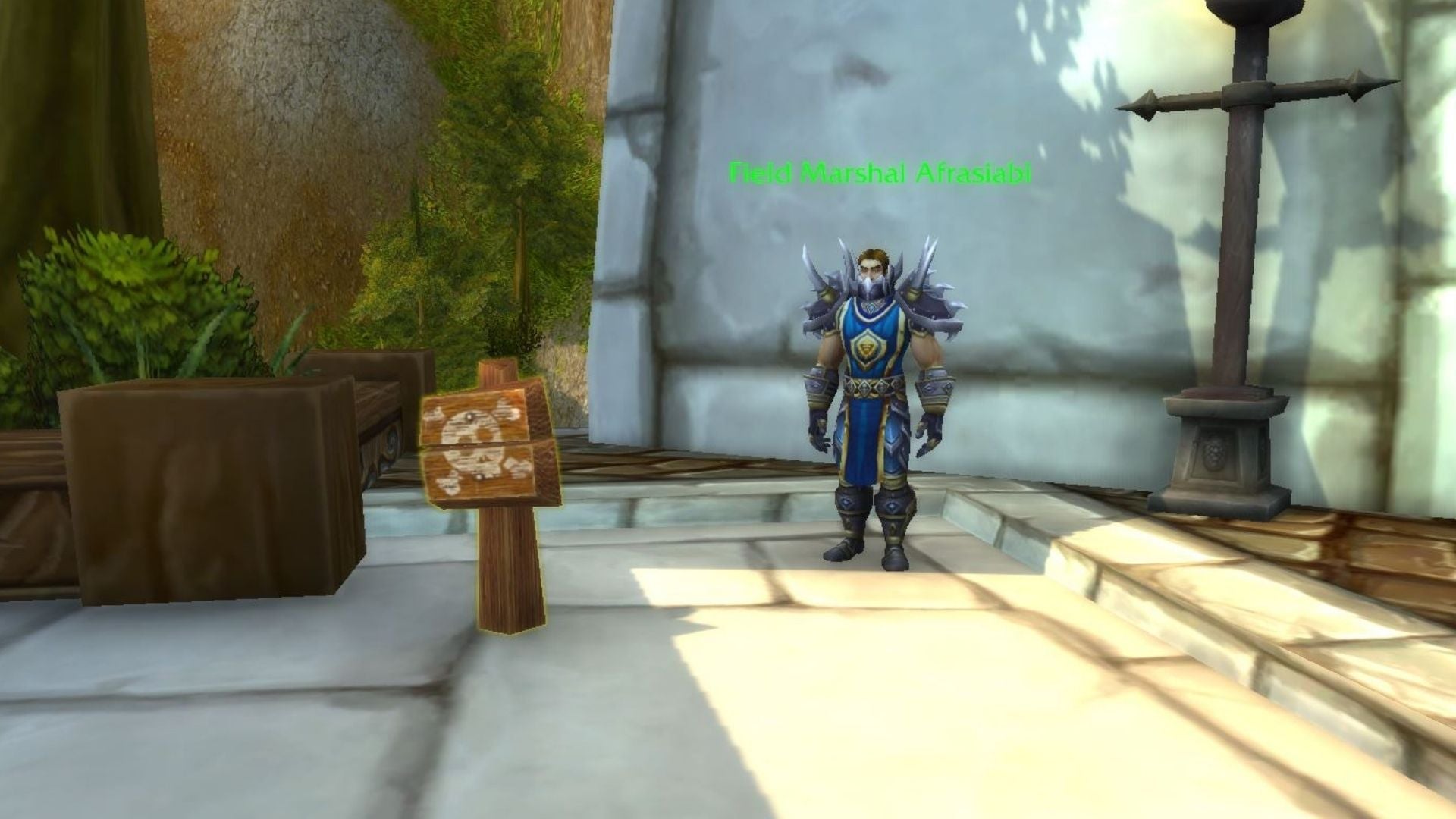 A player placed the toy item “Lilian’s Warning Sign” in front of an Afrasiabi NPC. Its tooltip reads, “Go Away!” 