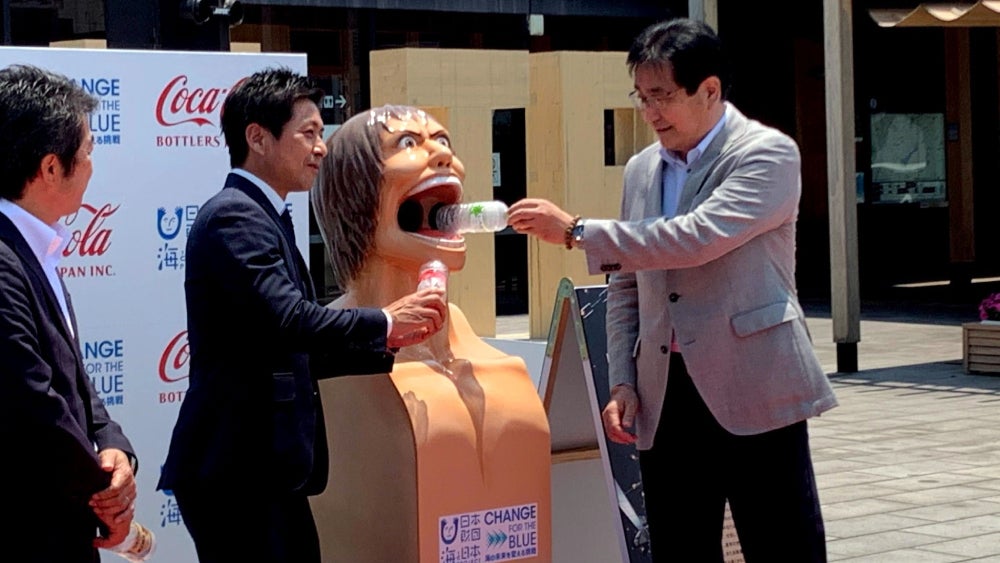 Feeding a Titan plastic bottles instead of human flesh.