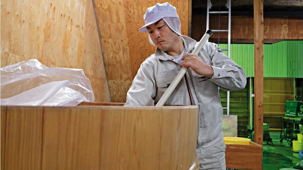 A brewer makes junmai-shu at the Miyoshino Sake Brewery in Nara. 