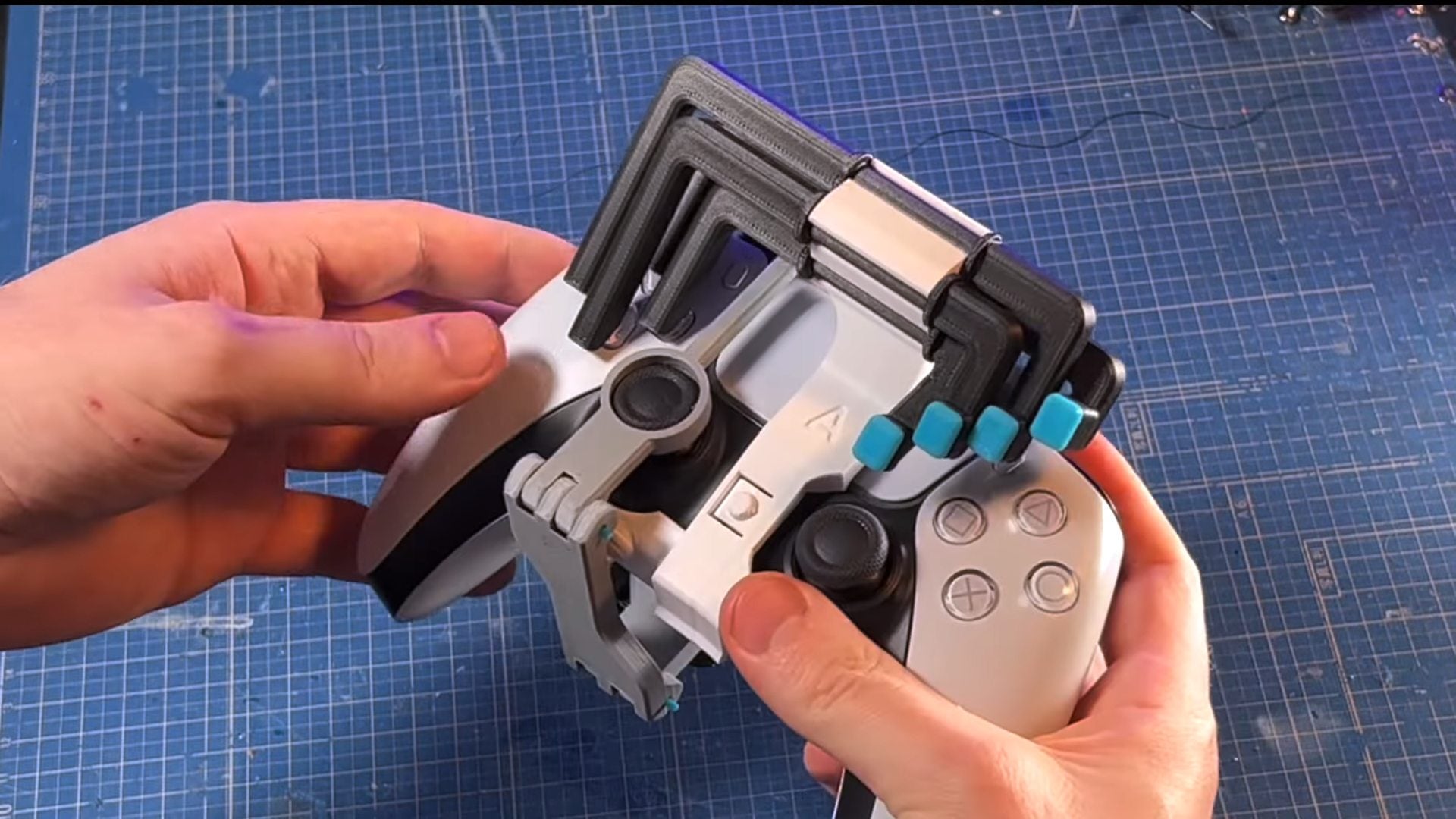 The d-pad attachment to the one-hand PS5 adapter is “a bit unwieldly.”