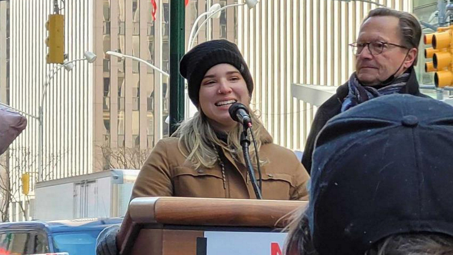 Kotaku editor Lisa Marie Segarra speaks at the rally on March 4 while WGAE executive director Lowell Peterson looks on.