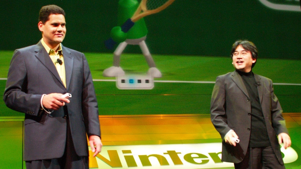 Reggie and Iwata on stage at Nintendo’s 2006 E3 press conference. 