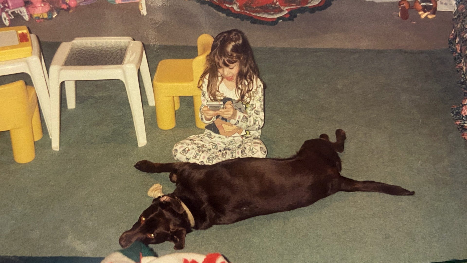 Young Alyssa, definitely not playing PlayStation, but absolutely running her mouth. 