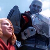 Commander Zavala smiles at a young girl.