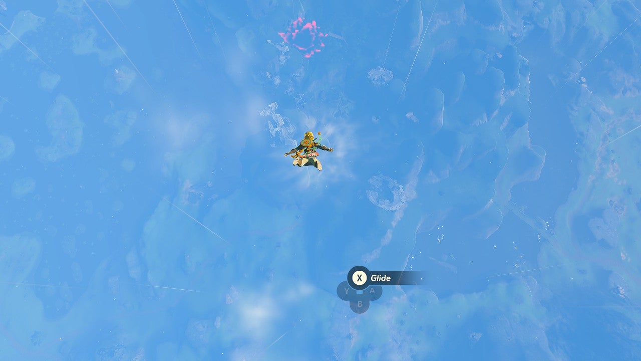 The village is just before that scary looking red pit.