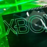 An Xbox Series X sits in a green case.