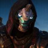Cayde-6 sits at a campfire.
