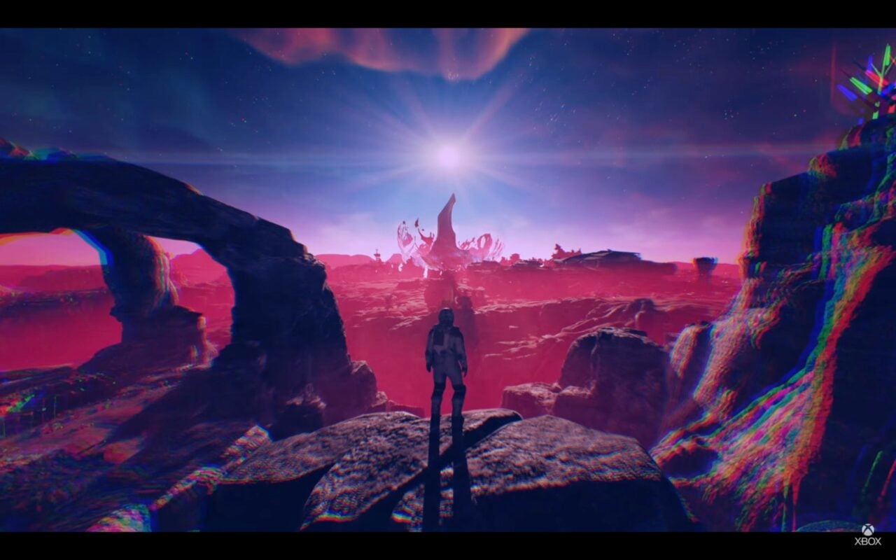 An astronaut stands on a strange planet.