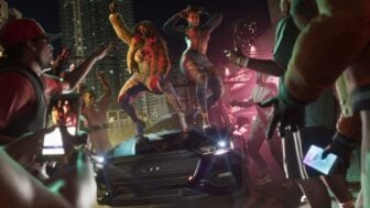 People dance on a car