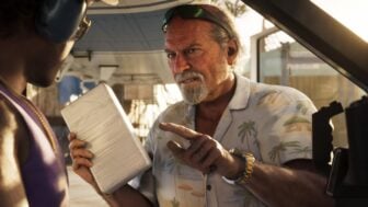 A man points his finger menacingly while holding a paper.