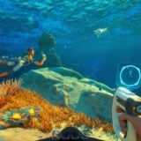 Someone holds up a pistol underwater.