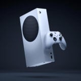 An Xbox Series S hangs in the air.
