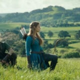 Link and Zelda stand in a field.