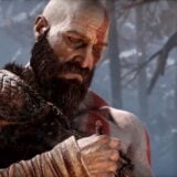 Kratos stares in sadness.