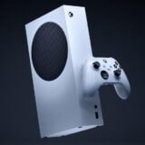 An Xbox Series S hangs in mid-air.