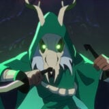 A hooded rogue character appears in green.