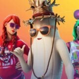 Peely is shirt-less next to two women.