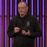Tim Sweeney appears on stage during an Unreal Fest event.