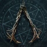 Whicker makes the Assassin's Creed symbol.