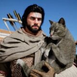 Kliff holds his cat.