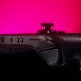 A Steam Deck glows pink.