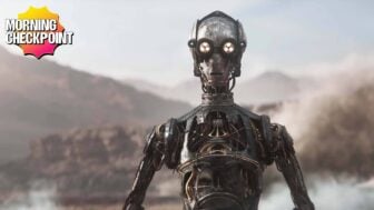 A droid appears in a desert.