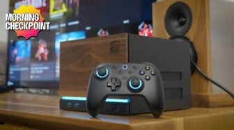 A DIY PC sits on a desk with wood paneling.