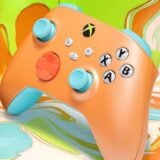 An Xbox controller appears in orange, green, and blue.