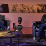 Pete Hines speaks with Phil Spencer on stage.