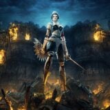 A doll warrior stands atop burning rubble.