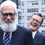 Stephen Colbert and David Letterman laugh.