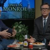Stephen Colbert shrugs on the set.