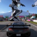 A Gundam races a car.