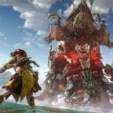 Aloy fights a giant robot in the water.