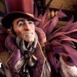 A weird-looking man wears feathers.
