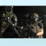 Operators sit in a helicopter.