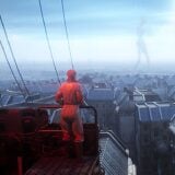 A scientist looks out at a city.