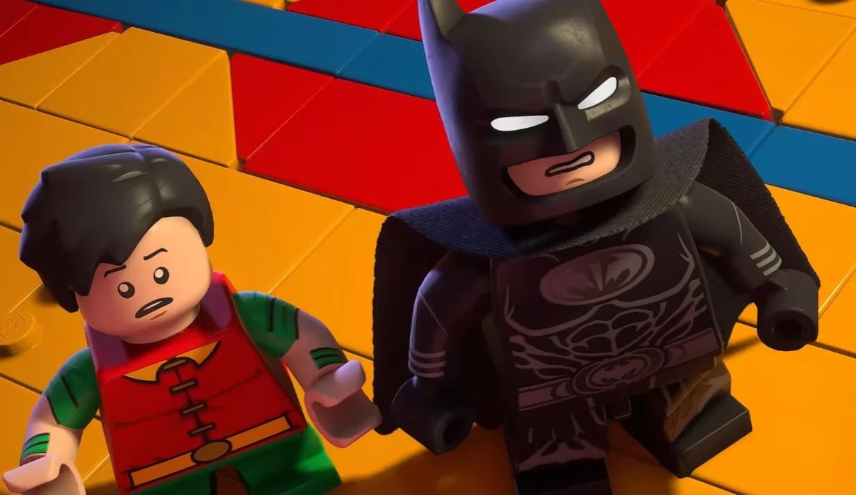 Batman and Robin look up at the ceiling.
