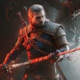 Geralt holds his sword.